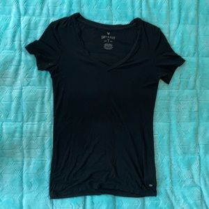 Woman’s black V neck top